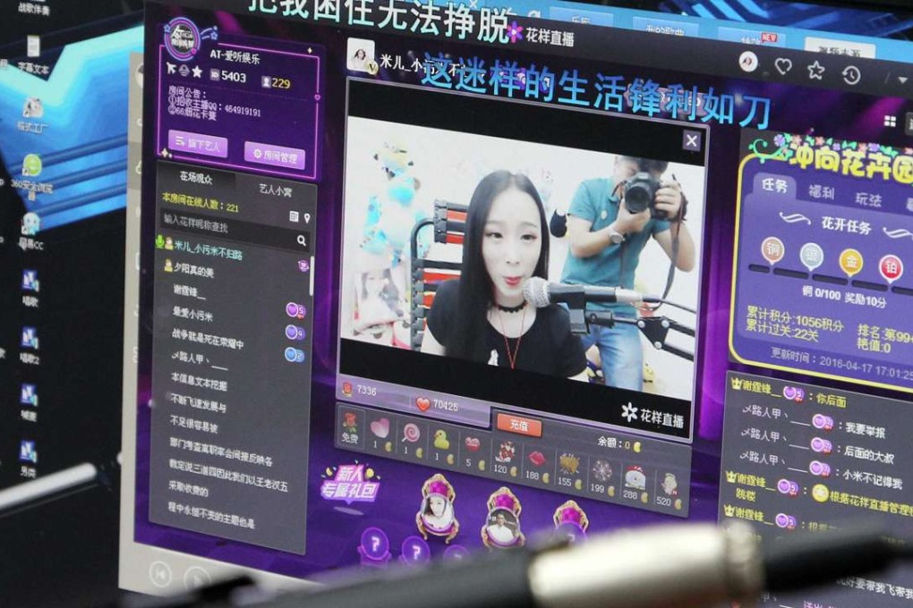 Xiao Mi (web name), an internet broadcast host, performing in her studio during a live web streaming in Zhengzhou, Henan province. Xiao Mi generally makes six hours of live streaming daily for her fans on the internet, and claims her monthly income can be upwards of 20,000 yuan (US$2,900). (Imaginechina)