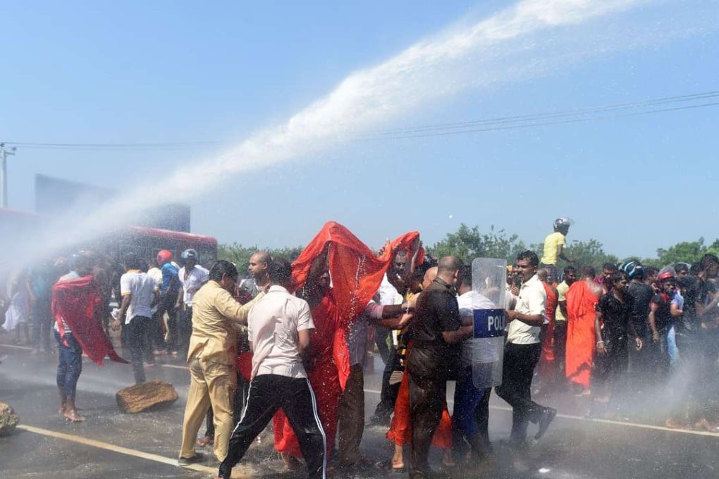 Sri Lankan police use a water cannon to disperse protesters in the southern port city of Hambantota in January. Sri Lankan nationalists, monks and local residents are protesting at the creation of an industrial zone there for Chinese investment. Photo: AFP