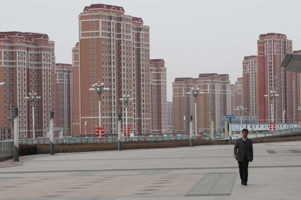Residential buildings in which only few people actually living in Kangbashi district, Ordos city, Inner Mongolia, on Feb. 16, 2017. Kangbashi is a totally new district built on desert, the local administrations have been moved to this new district, large number of new style buildings were built and many however were suspended due to lack of continuous financial support. 16FEB17 SCMP/Simon Song