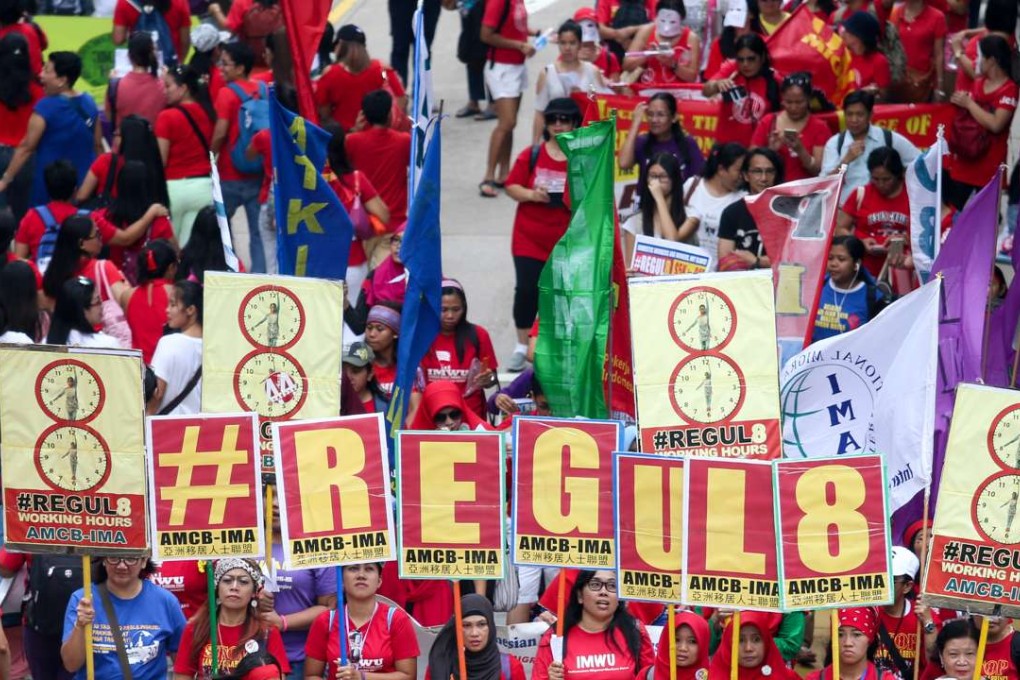 Members of the Asian Migrants’ Coordinating Body march for better pay, in Central last September. Photo: K. Y. Cheng
