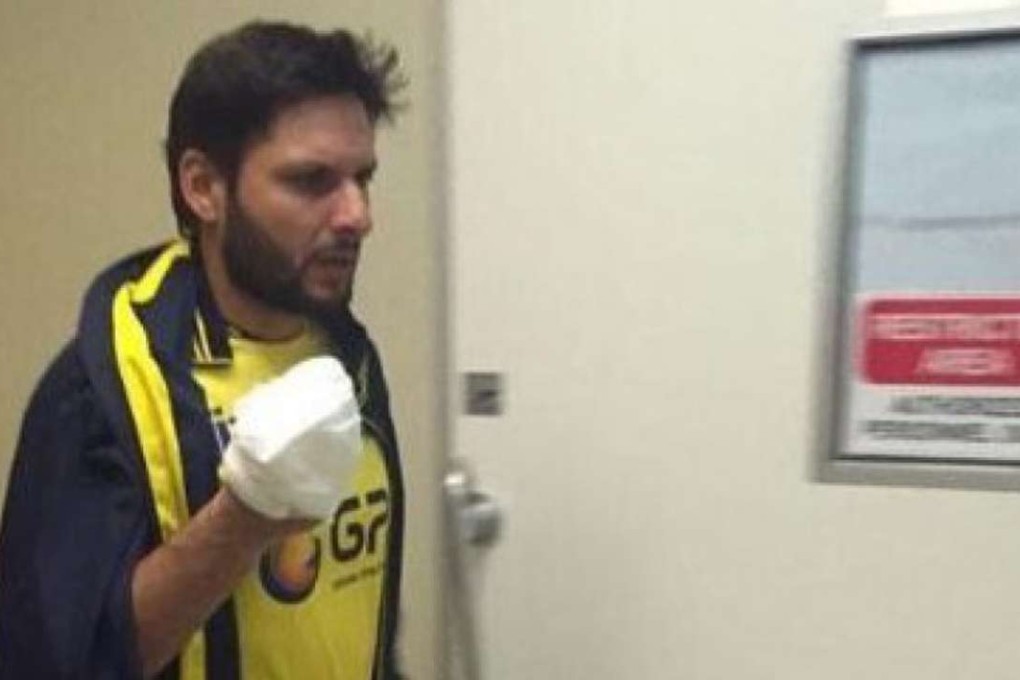 Shahid Afridi after having his hand bandaged. Photo: PSL