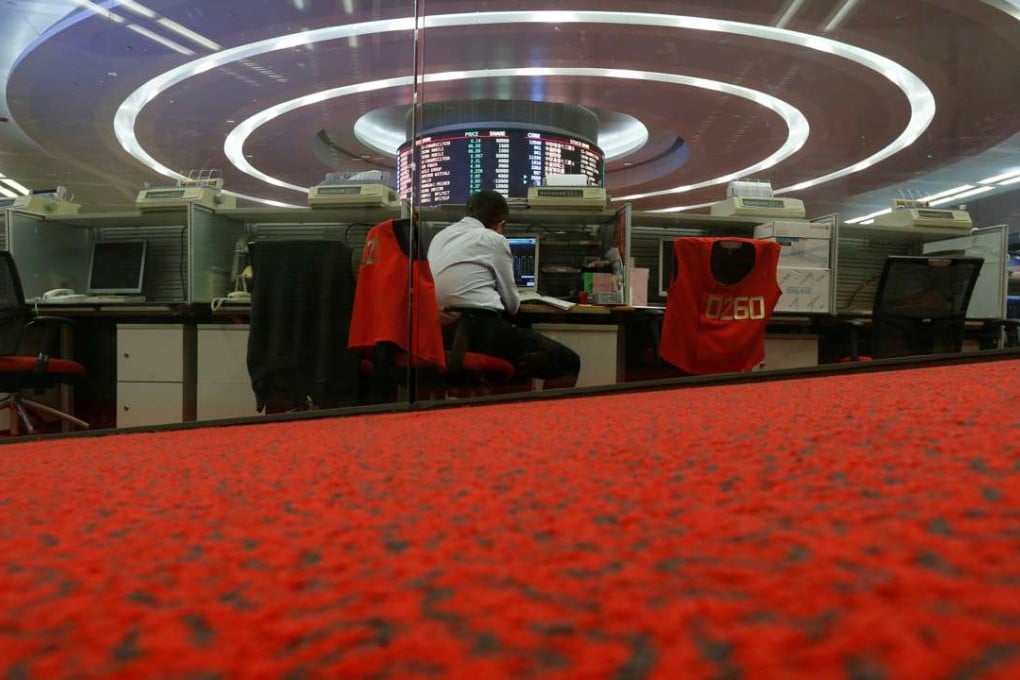 A trader monitors share prices at the Hong Kong Stock Exchange in Hong Kong. Photo: Reuters