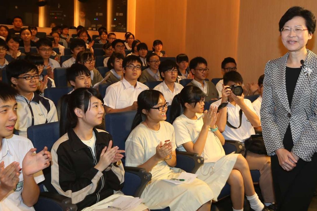 Then chief secretary Carrie Lam attends a forum with teenagers to discuss issues related to poverty, in Aberdeen in 2013. Photo: Sam Tsang