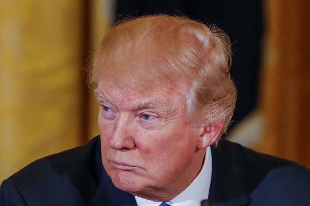 US President Donald Trump is having to confront the threat of hacking, along with leaks from his own administration. Photo: EPA