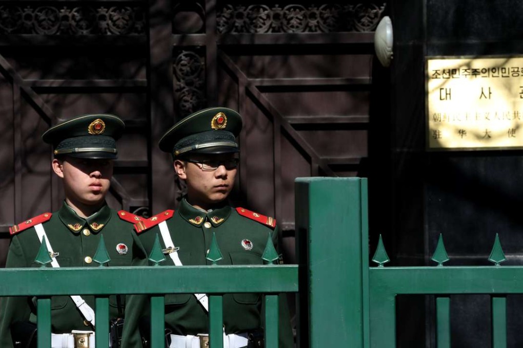 Chinese paramilitary police stand guard outside the North Korean embassy in Beijing on Tuesday. Photo: EPA