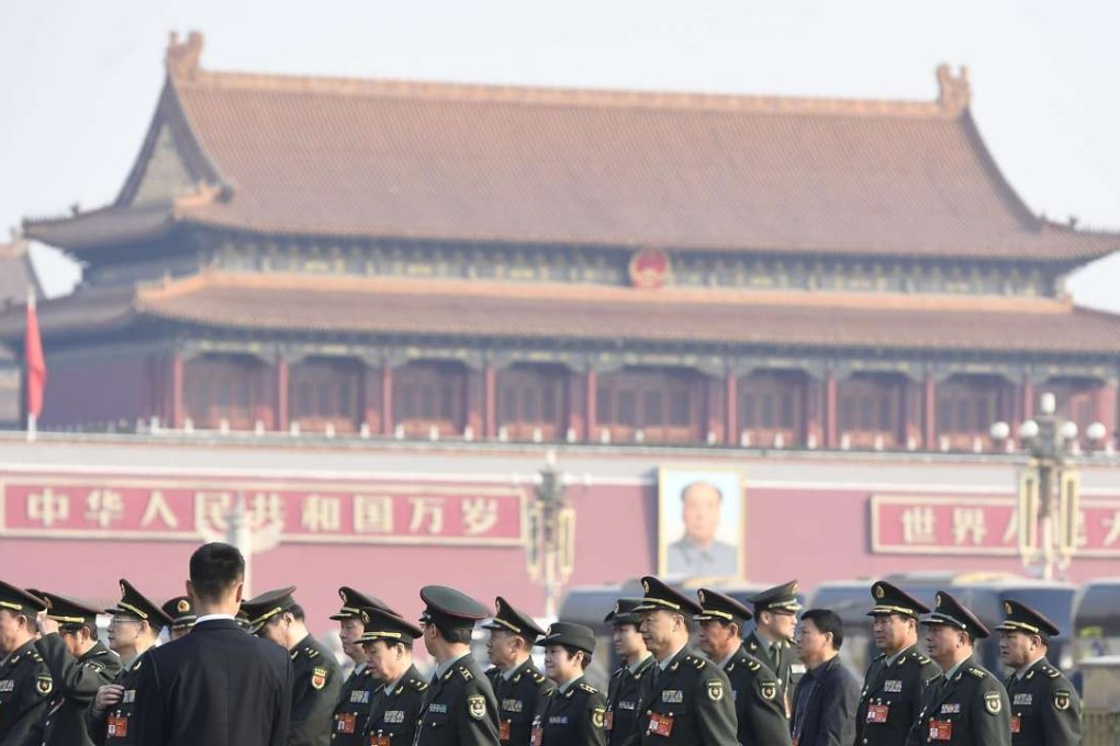 Senior officials in the People's Liberation Army walk to the Great Hall of the People during this month’s National People’s Congress. Photo: Kyodo