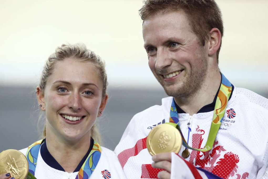Gold medallist Britain's Jason Kenny poses next to his then-fiancee Laura Trott at the Rio Olympics. His wife is now expecting their first child. Photo: AFP