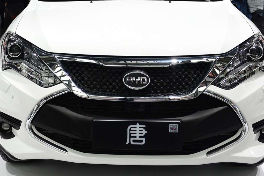 Visitors view a new energy car by automaker BYD at the International Auto Exhibition in Xi'an. Photo: Xinhua