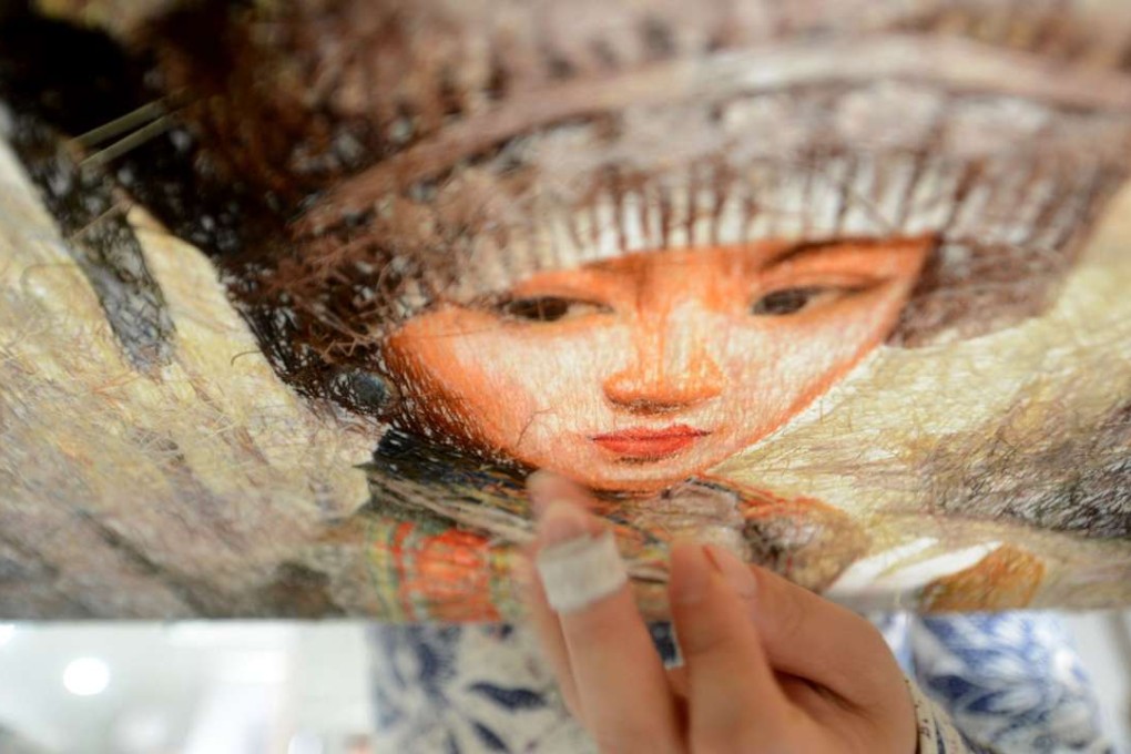 A woman in Yangzhou, Jiangsu province, works on an embroidery this week to mark International Women’s Day on Wednesday. The real issue of leftover women isn’t one of tradition or even nagging, overbearing parents. Photo: AFP