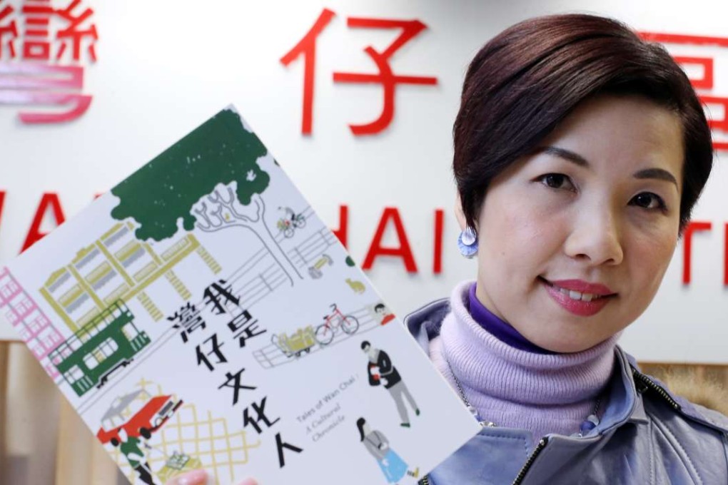 Wan Chai district councillor Yolanda NG Yuen-ting shows the book titled Tales of Wan Chai: A Cultural Chronicle. Photo: Dickson Lee