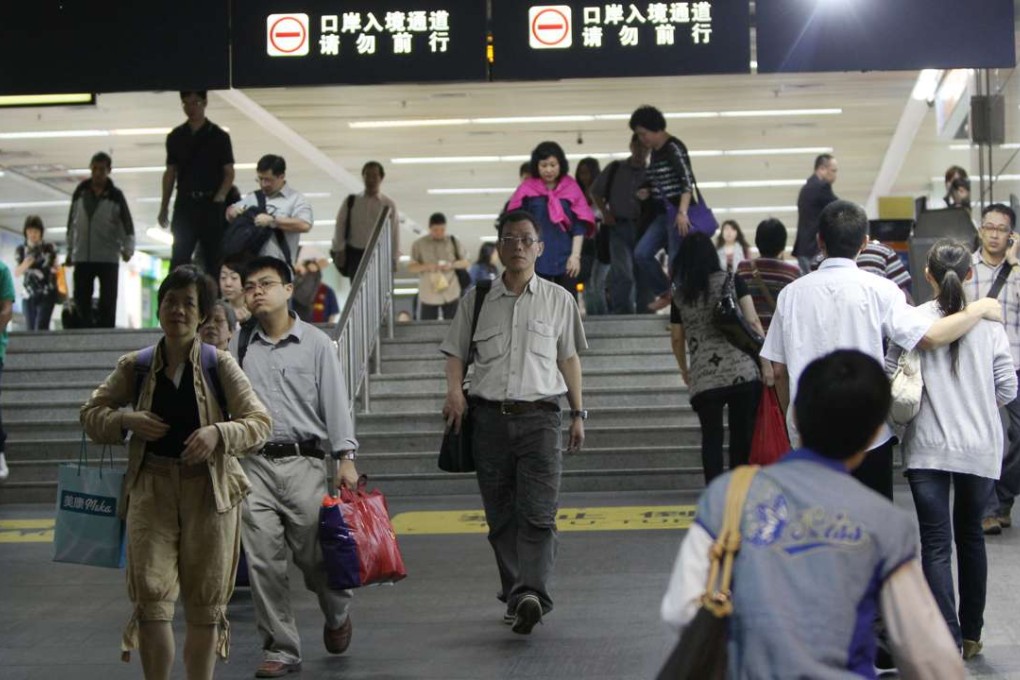 People travel to and from the mainland via the Lo Wu border crossing in 2012. Photo: David Wong