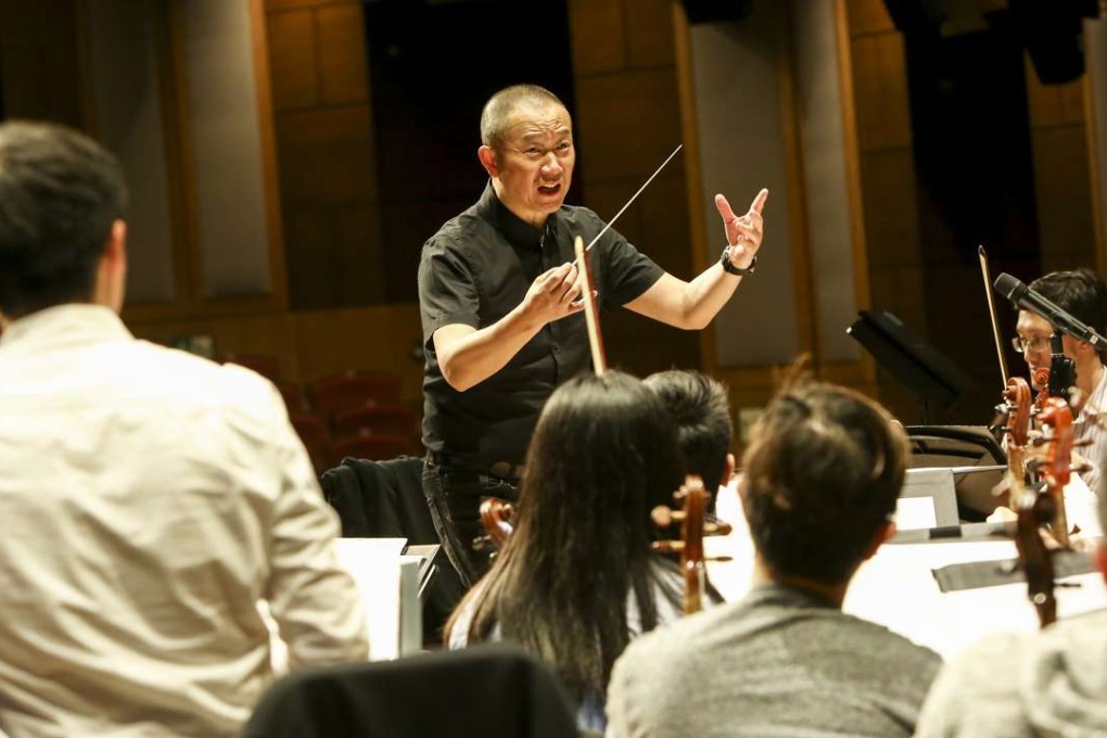 Composer Tan Dun works with the Hong Kong String Orchestra and local universities students for a joint concert. Photo: Jonathan Wong