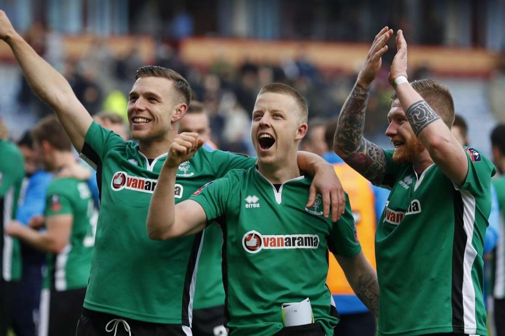 Lincoln's Alan Power, Terry Hawkridge and Jonathan Jack Muldoon celebrate their win over Burnley. Photo: Reuters