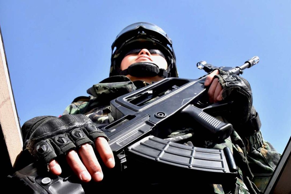A file picture of a Chinese military policeman attending an anti-terrorist oath taking rally in Hetian in Xinjiang. Photo: AFP