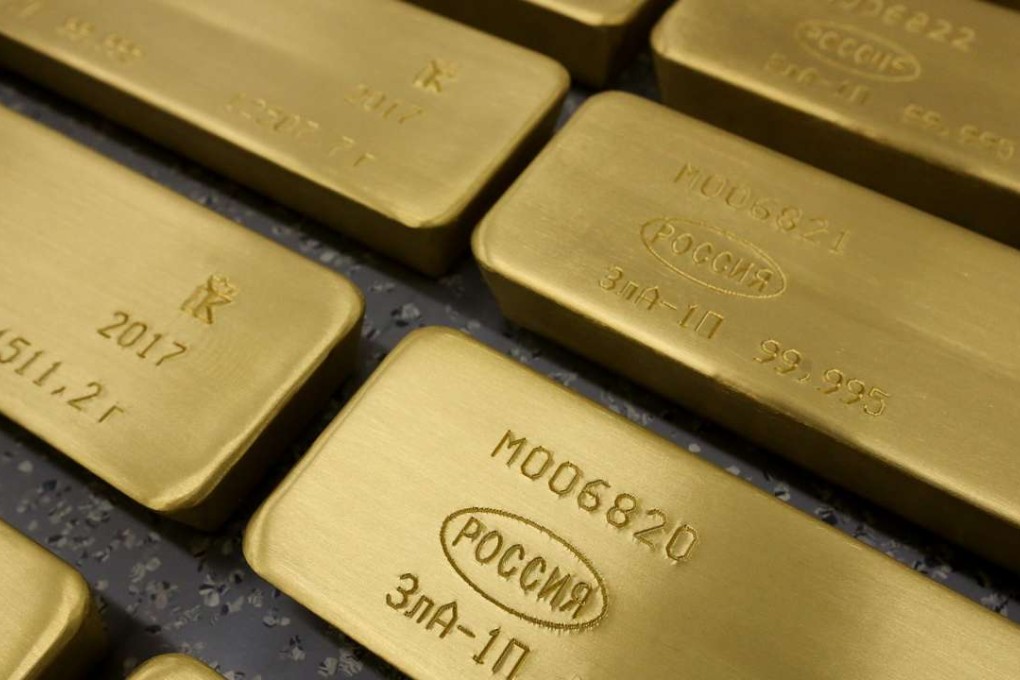 Gold bars with engravings to identify the purity content, the year of manufacture and the country of origin, sit on a trolley ahead of distribution at the JSC Krastsvetmet non-ferrous metals plant in Krasnoyarsk, Russia. Photo: Bloomberg