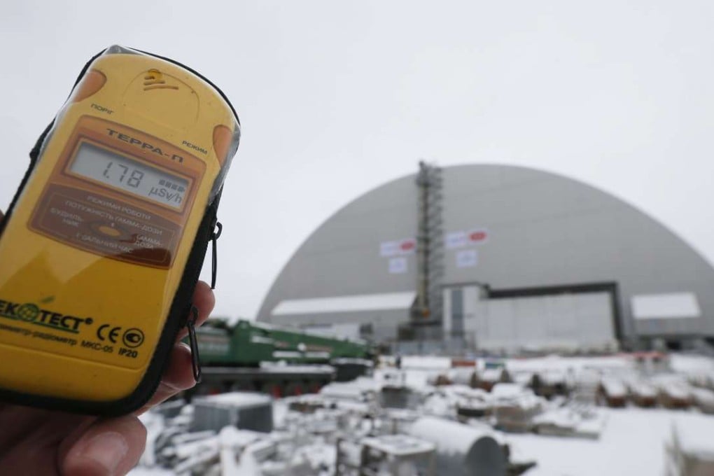 A dosimeter shows the radiation level near a new protective shelter placed over the remains of nuclear reactor Unit 4, at the Chernobyl nuclear power plant in Ukraine, on November 29. The explosion of Unit 4 in the early hours of April 26, 1986, is still regarded as the biggest accident in the history of nuclear power generation. Photo: EPA
