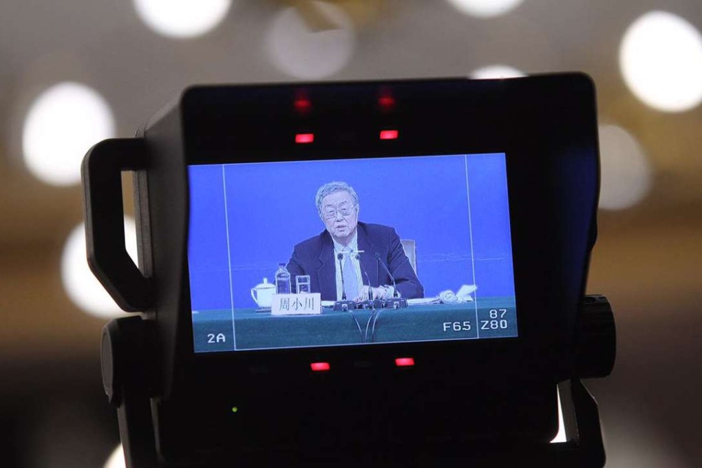 Zhou Xiaochuan, governor of the People's Bank of China, speaks to the press at the media centre in Beijing on Friday morning. Photo: Simon Song
