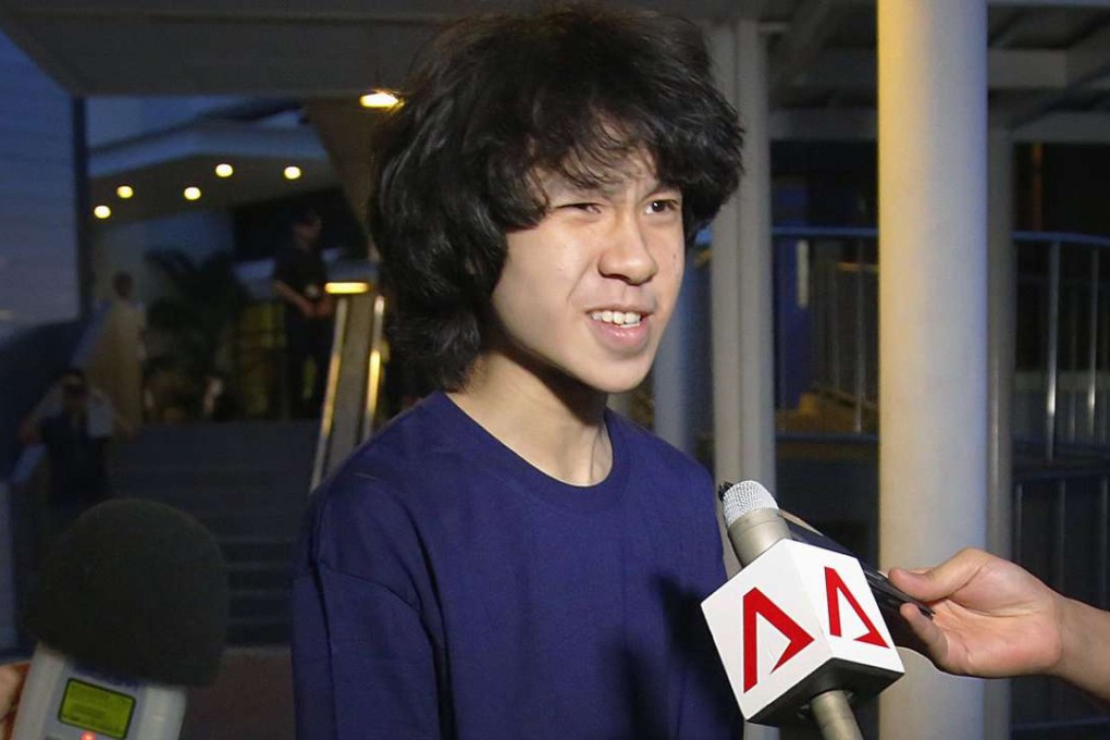 In this 2015 file photo, Singapore teen blogger Amos Yee speaks to reporters while leaving the Subordinate Courts after being released on bail in Singapore. Yee, who is seeking seeking asylum after online posts mocking his government landed him in jail, is awaiting the decision of a US immigration judge on his petition. Photo: AP