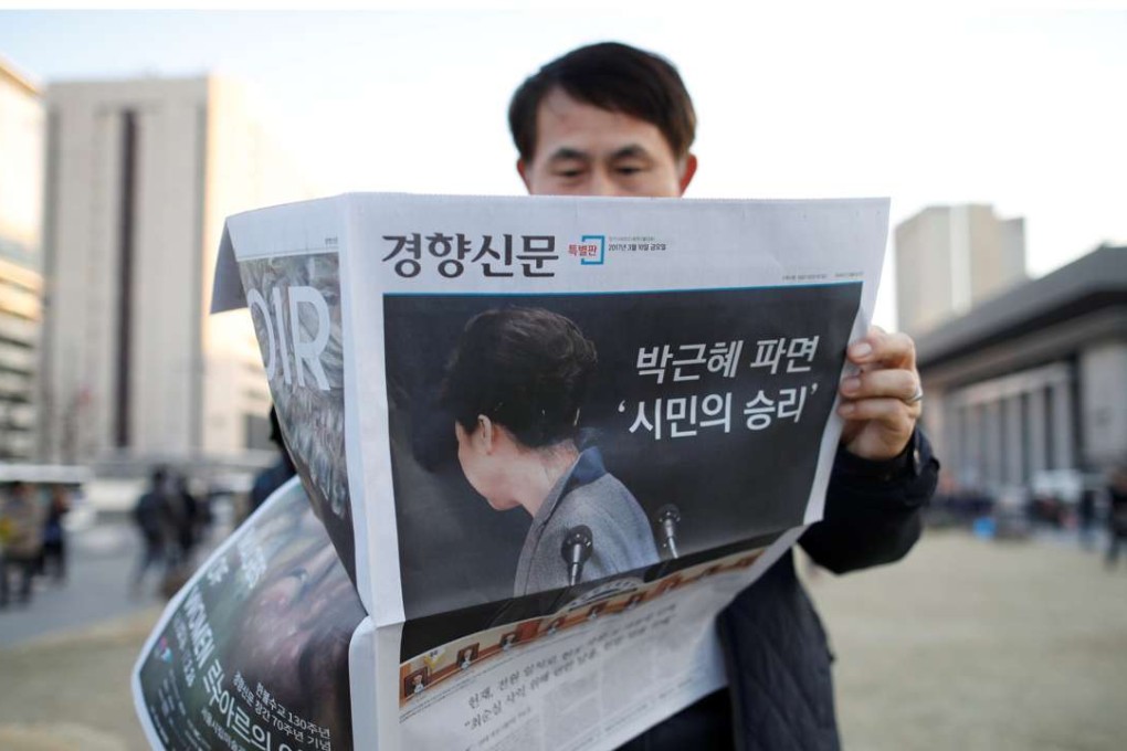 Press coverage of Park’s exit. Photo: Reuters