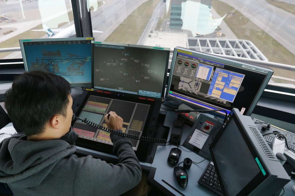 An air traffic controller using the new system at the north Aerodrome Tower at Hong Kong International Airport. Photo: Dickson Lee