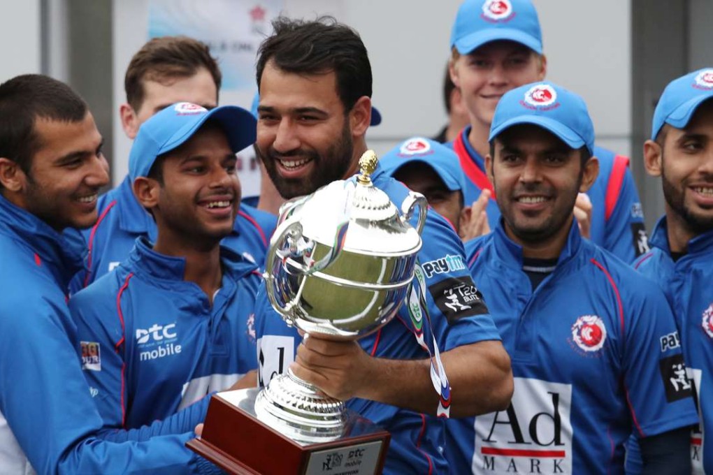 Kowloon Cantons captain Babar Hayat (centre) and team members celebrate their win at the Hong Kong T20 Blitz at Tin Kwong Road. Photos: Nora Tam