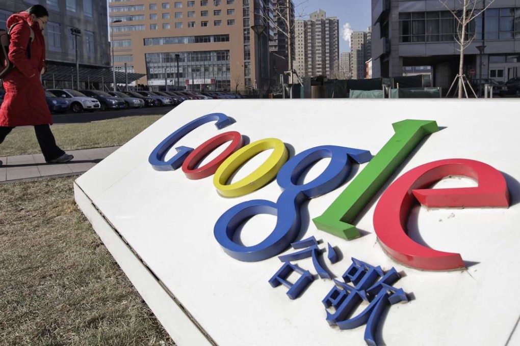 A woman walks past the logo of Google in front of its headquarters in Beijing in 2011. Google has been keen to return to China since it pulled out in 2010. Photo: Reuters