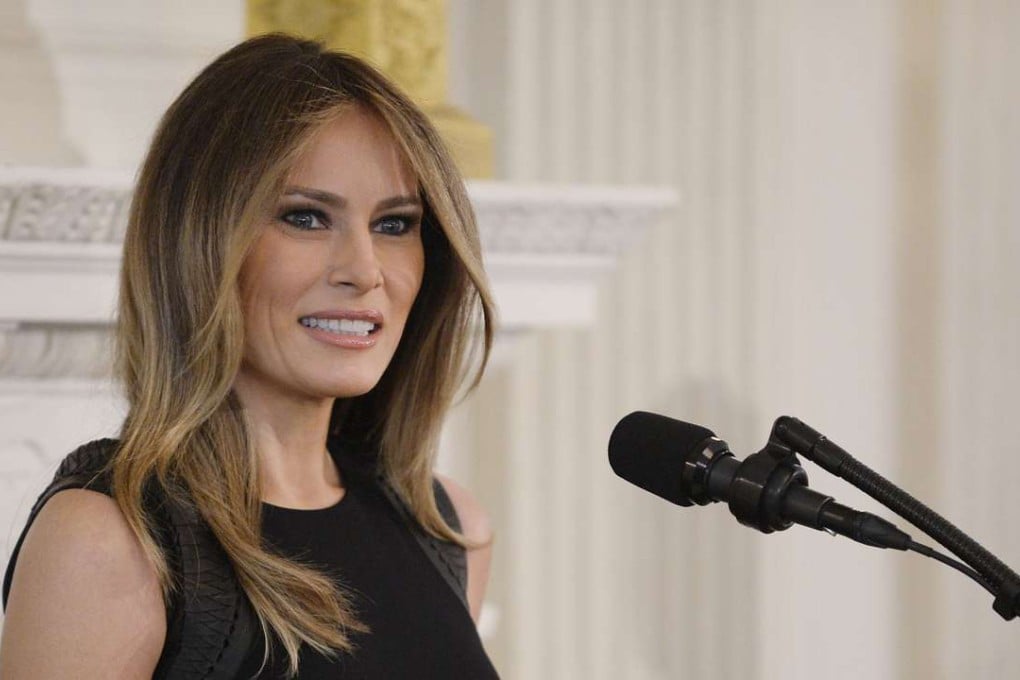 First Lady Melania Trump speaks during a lunch event for International Women's Day in the State Dinning Room of the White House. Photo: TNS