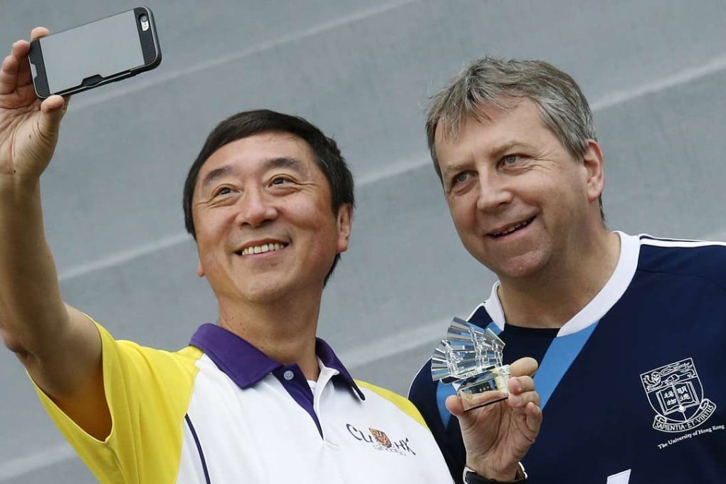 Joseph Sung (left) and Peter Mathieson attend the annual soccer match. Chinese University beat the University of Hong Kong 2-0. Photo: David Wong
