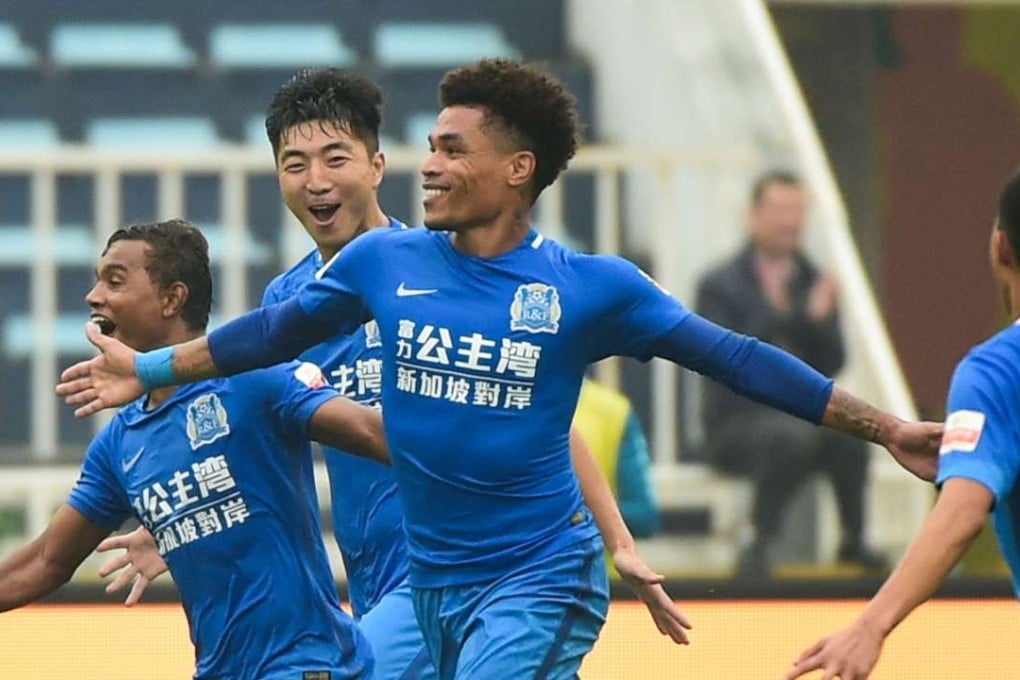 Brazilian Junior Urso celebrates scoring for Guangzhou R&F against Changchun Yatai. Photos: Xinhua 新华社记者刘大伟摄