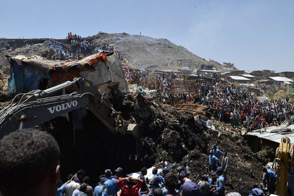 Residents gather on Sunday at the site of a massive garbage dump landslide on the outskirts of Ethiopia's capital Addis Ababa. Photo: Xinhua