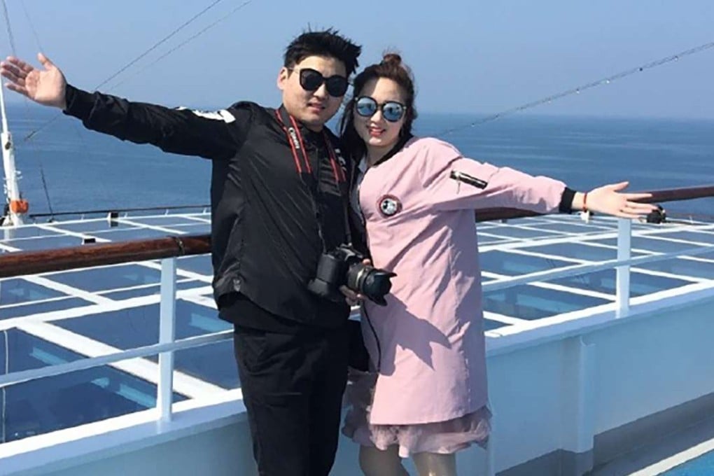 A Chinese couple who were among the 3,300 tourists who refused to disembark at Jeju Island for sightseeing on Saturday. Photo: Handout