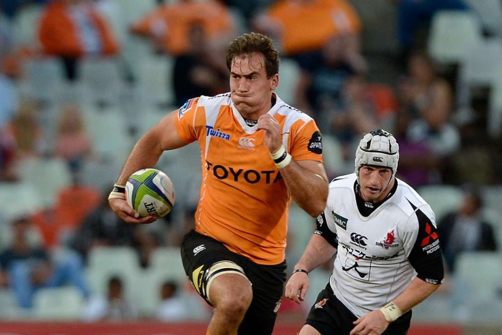 Henco Venter of the Cheetahs breaks away from Hayden Cripps of the Sunwolves. Photo: EPA