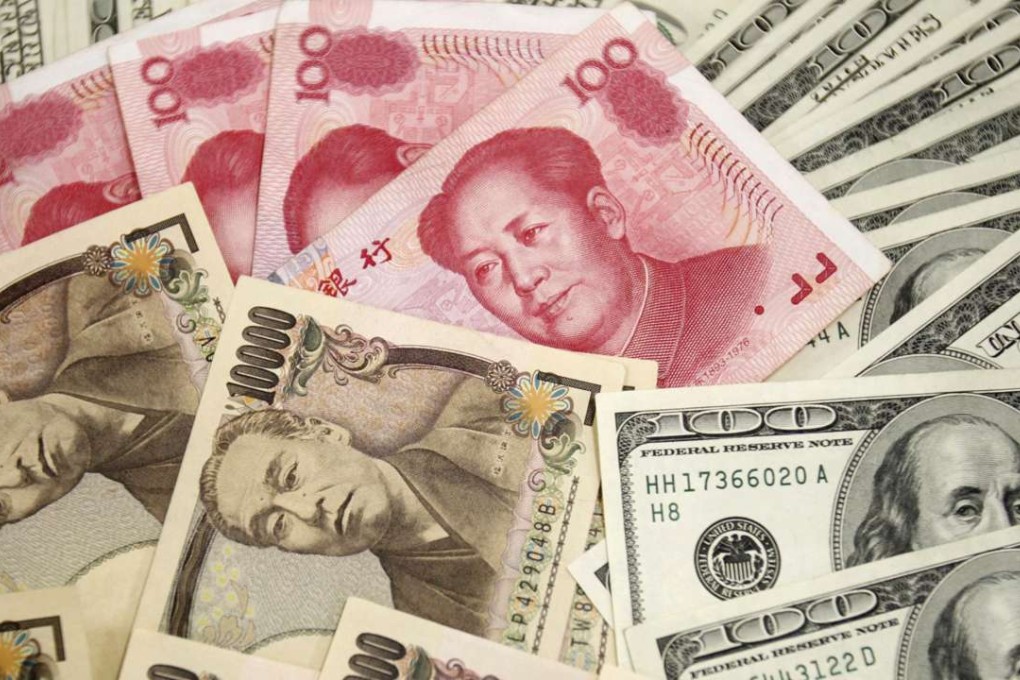 Japanese 10,000 yen notes, US$100 notes and Chinese 100 yuan notes. Photo: Reuters