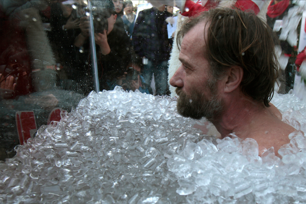 Wim Hof, who holds a Guinness world record for the longest time swimming under ice, immerses himself in ice water during a 2010 event to raise public awareness of global warming. Photo: Tyrone Siu/REUTERS