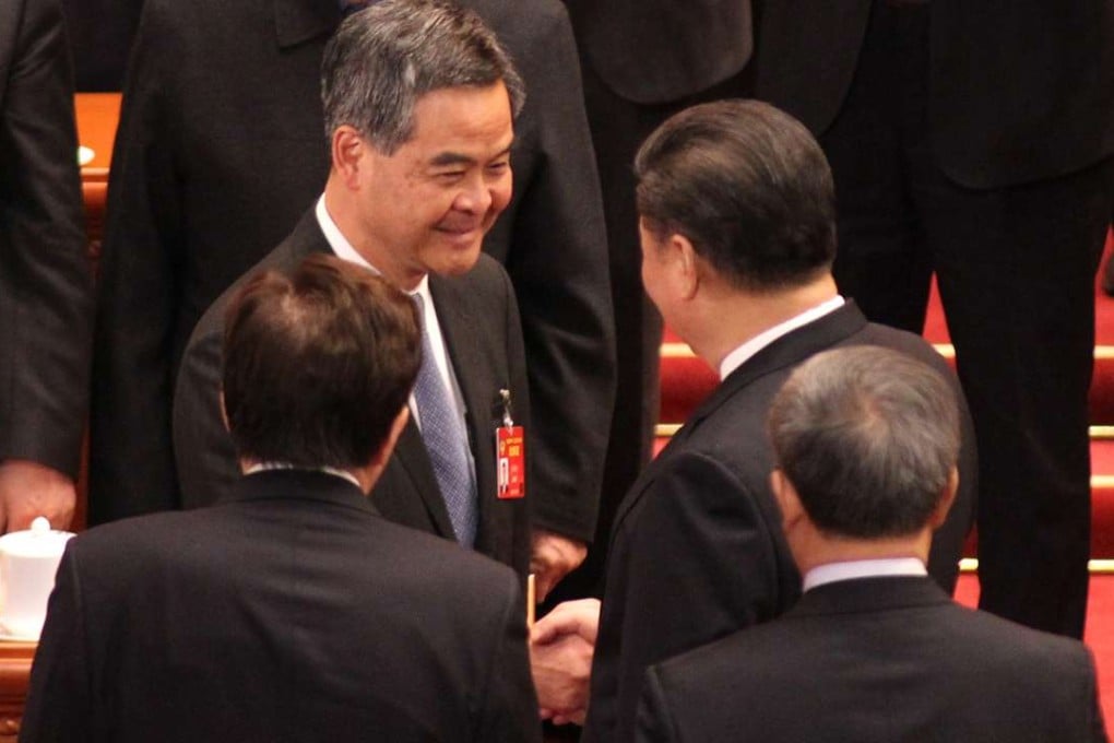 Chief Executive Leung Chun-ying and President Xi Jinping shake hands following the closing ceremony of the CPPCC meeting in Beijing. Photo: Simon Song