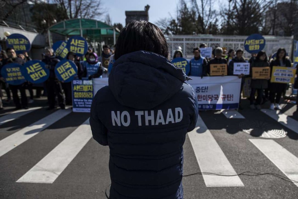 A group of activists holds a rally in front of the Defence Ministry in Seoul, South Korea, last week, to voice their objection to the planned deployment of the THAAD anti-missile defence system. Photo: EPA