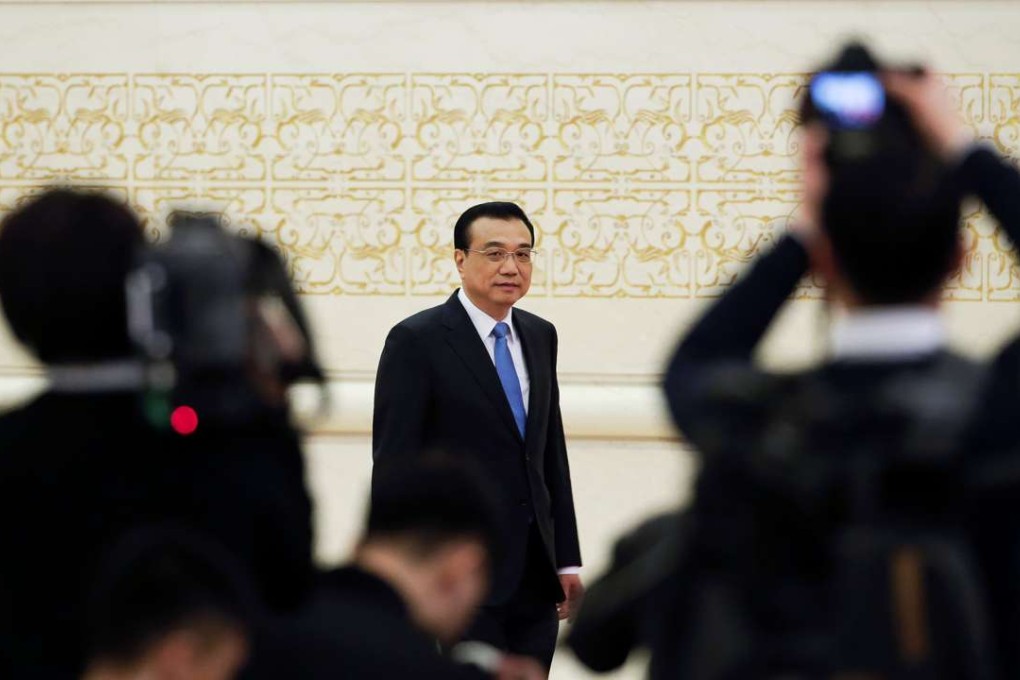 Chinese Premier Li Keqiang arrives for a news conference after the closing ceremony of China's National People's Congress. Photo: Reuters