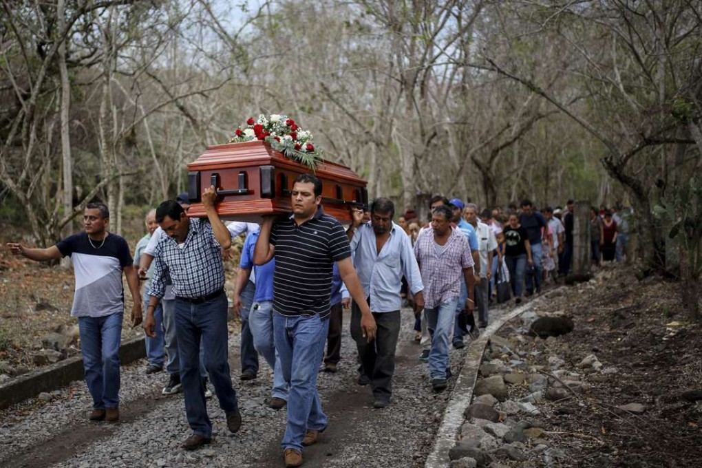 Members of a search group carry the coffin of Pedro Huesca, a police detective who disappeared in 2013 and was recently found in a mass grave, as they walk to the cemetery in Palmas de Abajo, Veracruz, Mexico, last Wednesday. Huesca's remains are part of a collection of more than 250 skulls found over the last several months on the outskirts of the city of Veracruz. Photo: AP
