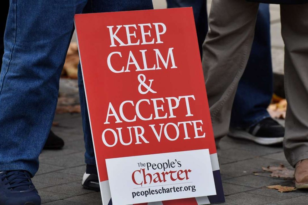 A poster from pro-Brexit group People’s Charter makes the sentiment clear as protesters gather at an anti-EU demonstration outside the Houses of Parliament in London, on November 23. Photo: AFP