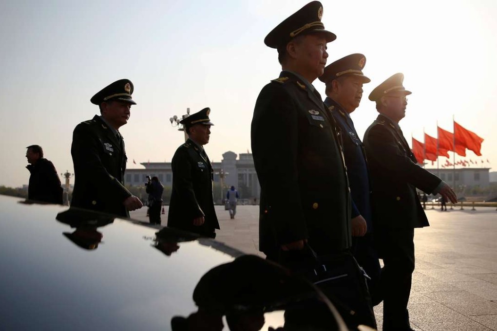 Military delegates arrive for the closing ceremony of the China's National People's Congress at the Great Hall of the People in Beijing on Wednesday. Photo: Reuters