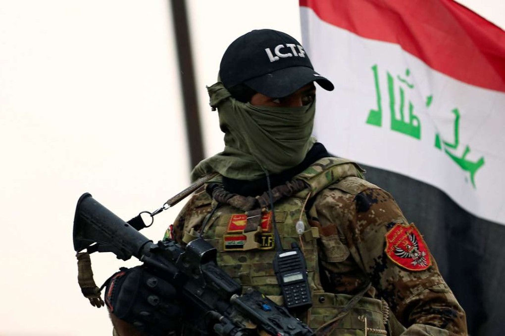 A member of the Counter Terrorism Service (CTS) carries his weapon during a battle between Iraqi forces and Islamic State militants in the city of Mosul, Iraq. Photo: Reuters