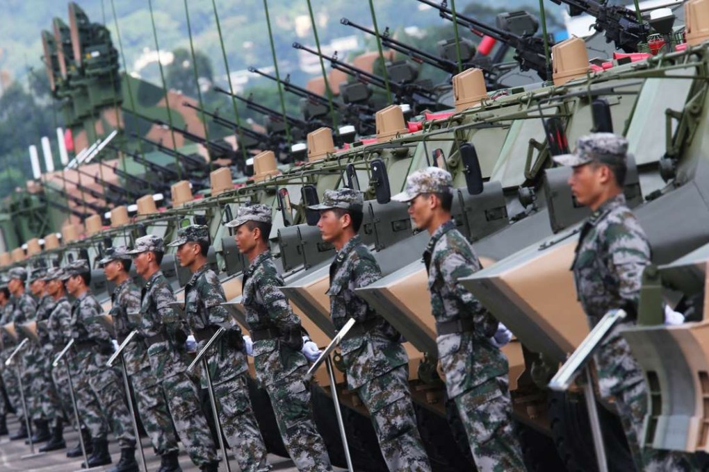 Soldiers from the People's Liberation Army Hong Kong garrison march during a military parade. The garrison is restricted from interfering in local affairs. Photo: Sam Tsang