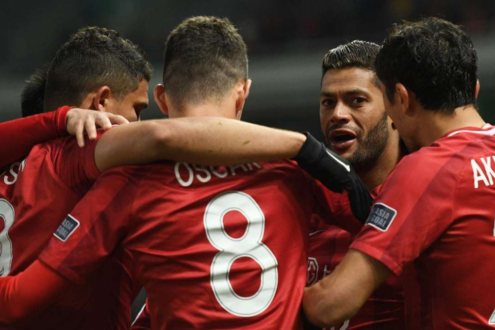 Shanghai SIPG players celebrate against Japan's Urawa Red Diamonds. Photos: AFP