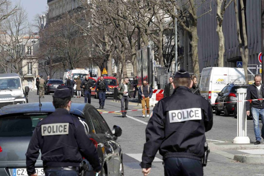 Police outside the International Monetary Fund (IMF) offices where an envelope exploded in Paris. Photo: Reuters