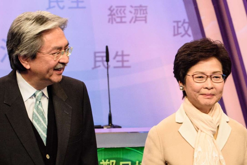 Hong Kong's leadership candidates, John Tsang (L) and Carrie Lam faced off with former judge Woo Kwok-hing in their first televised debate in Hong Kong. Photo: AFP