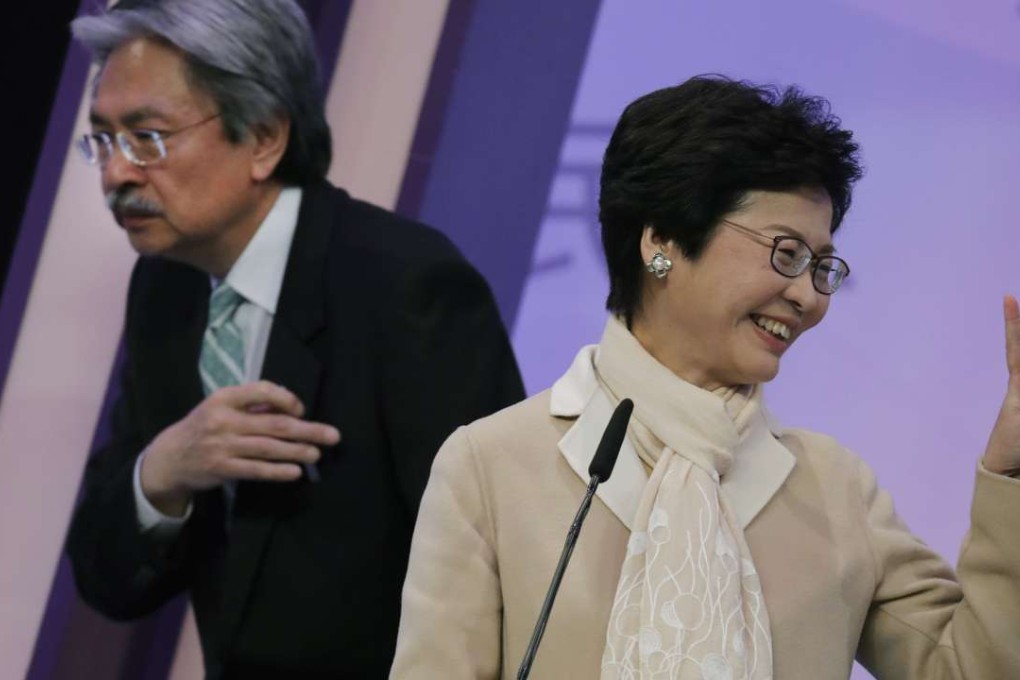 Chief executive candidates Carrie Lam and John Tsang attend a debate in the run-up to the vote on Sunday, March 26. Photo: AP
