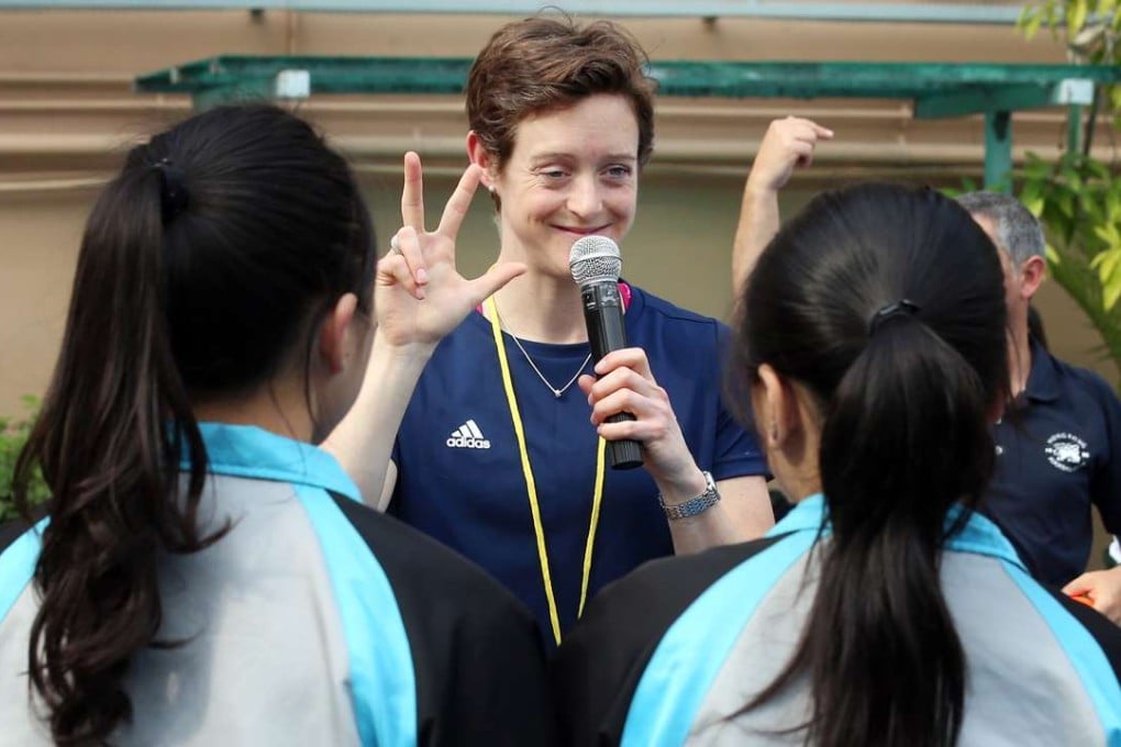 Dr Hannah MacLeod, English gold-medal winning Rio Olympian, gives a hockey clinic to young Hong Kong school children. Photo: K. Y. Cheng