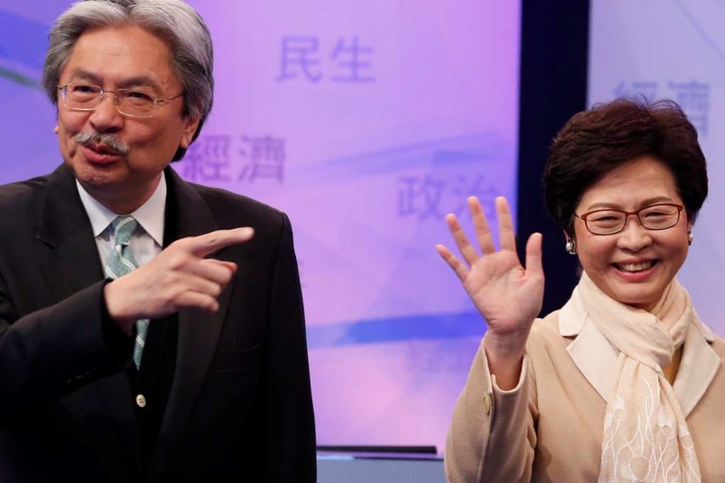 Chief executive candidates John Tsang and Carrie Lam attend an election debate on Tuesday. Beijing has made known its preferences through various channels from an early stage – no to Tsang, the former financial secretary who is leading in the opinion polls, but full support for former chief secretary Lam, the likely winner. Photo: Reuters