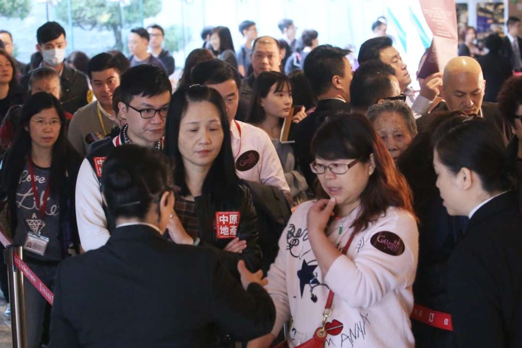 Potential buyers thronged the sales office of the Cullinan West apartments. Sun Hung Kai Properties, the developer, sold more than 80 per cent of the 309 units on offer on Saturday. Photo: Edward Wong