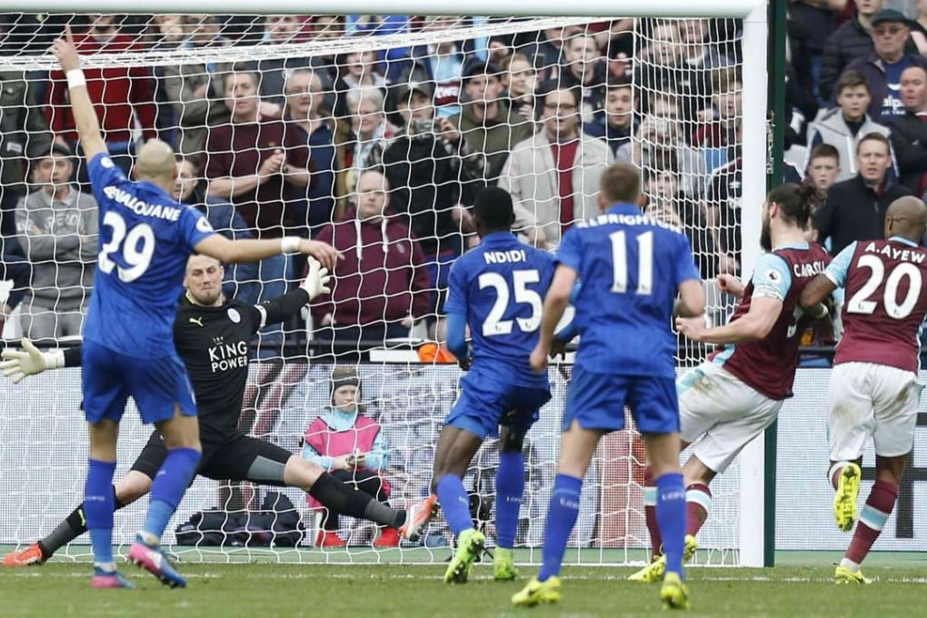 Leicester City goalkeeper Kasper Schmeichel saves a shot from West Ham’s Andy Carroll during the 3-2 win. Photo: AFP